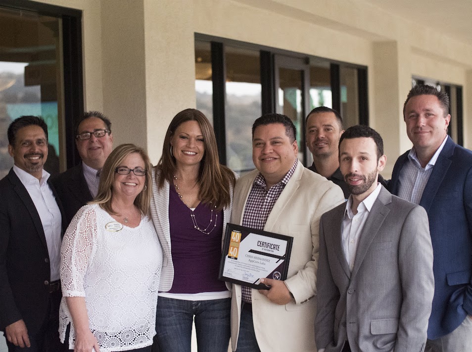 Chris receiving 40 Under 40 certificate